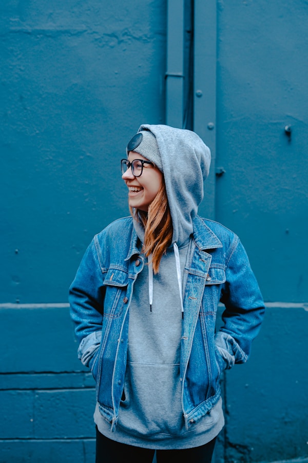 A person smiling while holding a sweet treat